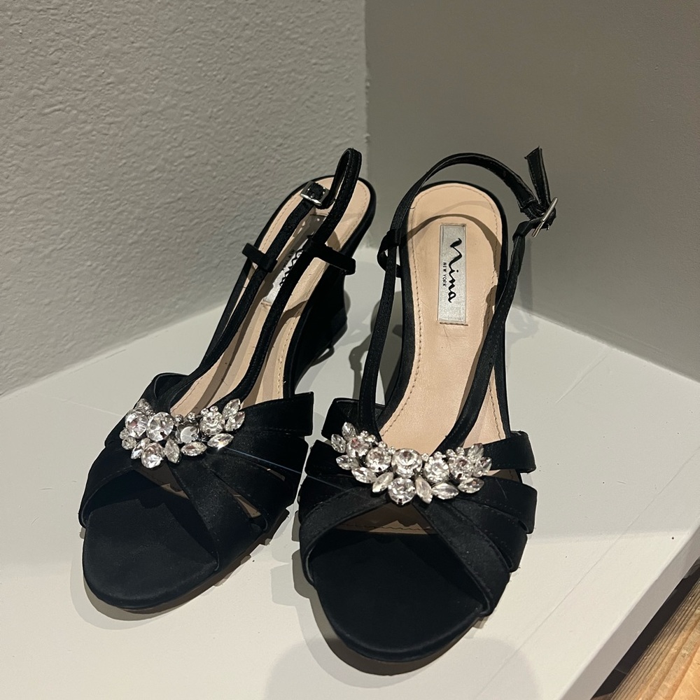 Black 8.5 Nina Wedges with one missing stone. Worn only once.